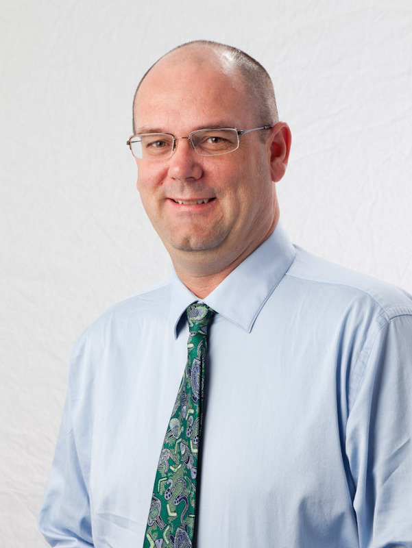 Dr. E Brendan Roark